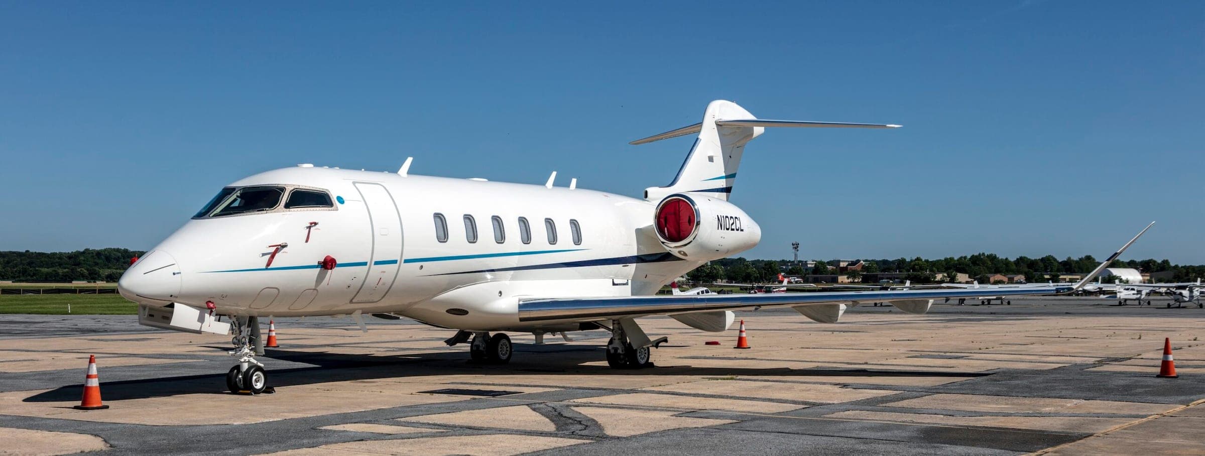 Bombardier Challenger 300 Exterior on ground at airport with reg number N102CL