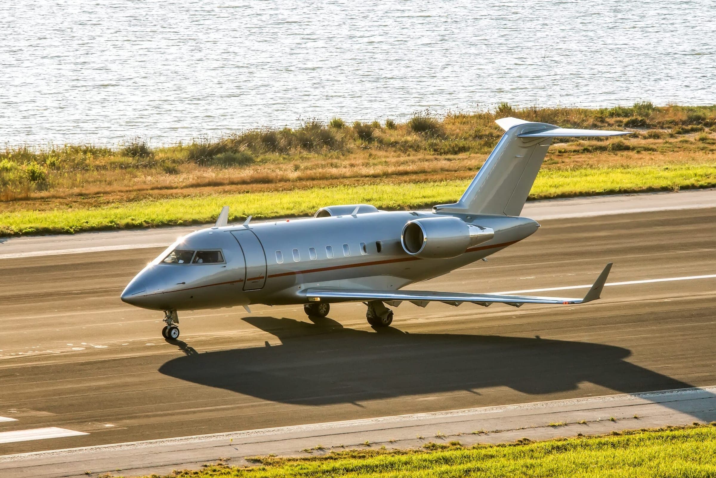 Bombardier Challenger aircraft in VistaJet livery taxiing for take off at Corfu Ioannis Kapodistrias international airport