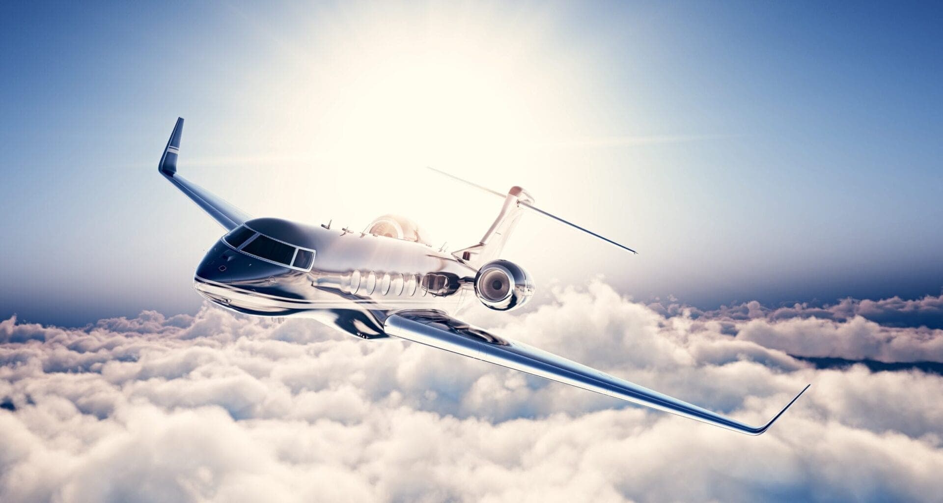 Image of black luxury generic design private jet flying in blue sky. Huge white clouds and sun at background.