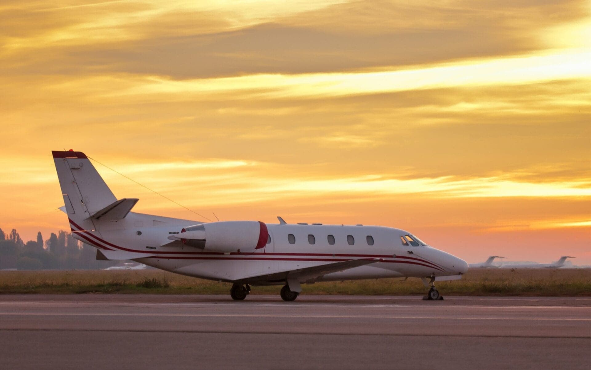 Cessna Citation XLS exterior view on ramp with golden sky behind