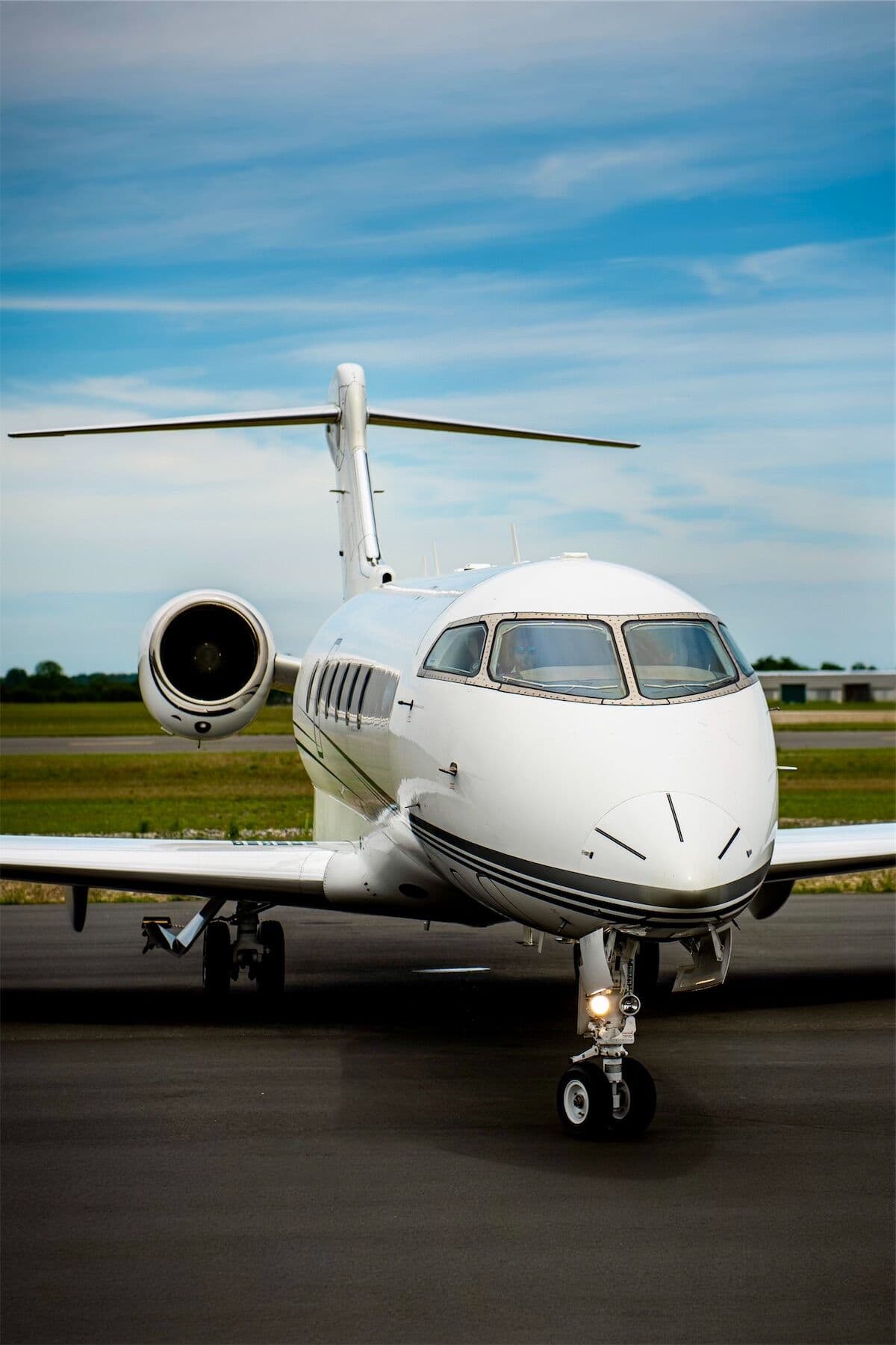 A CRAFT Challenger taxiing toward the camera on a sunny ramp