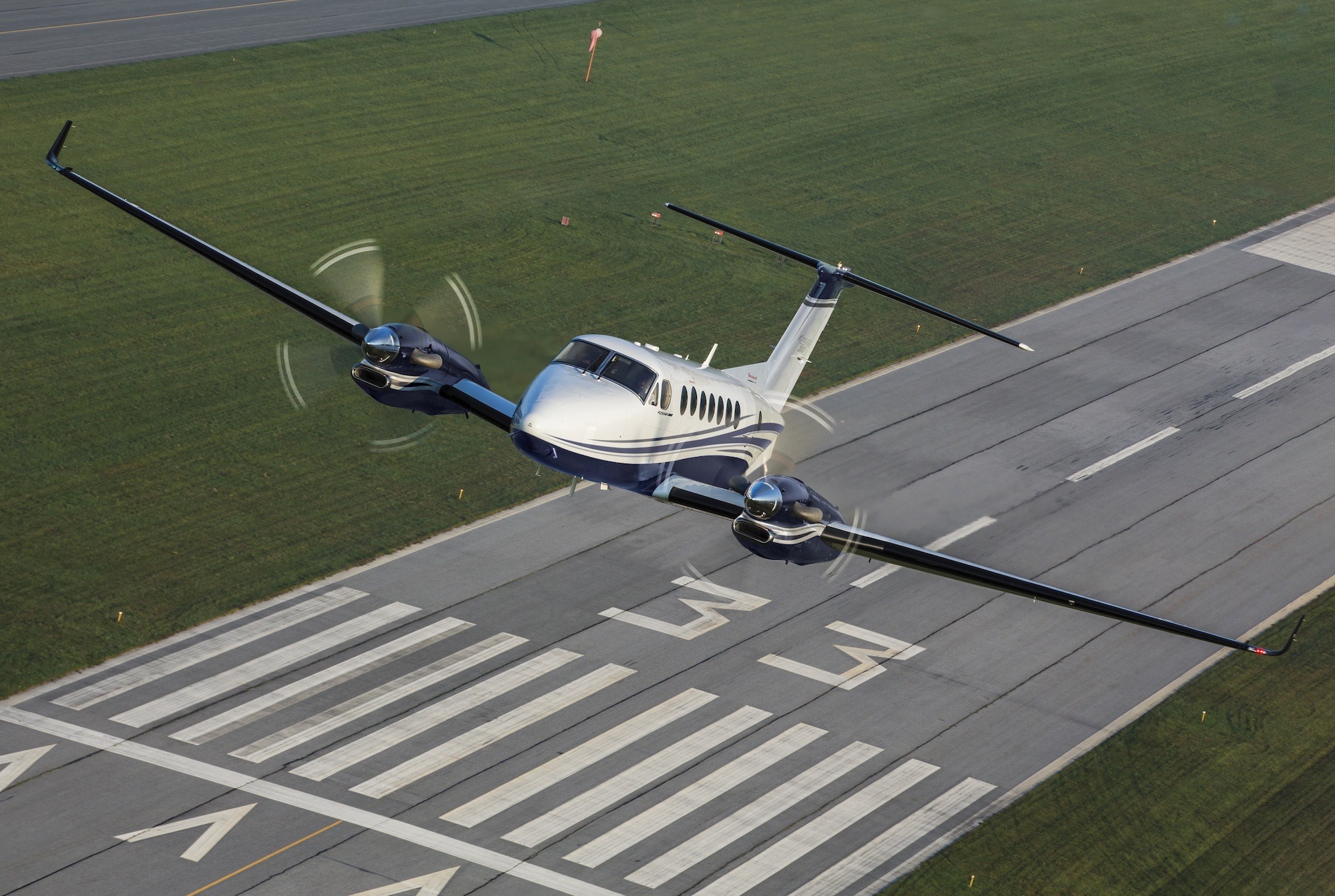 Beechcraft King Air 360 Exterior takeoff from runway
