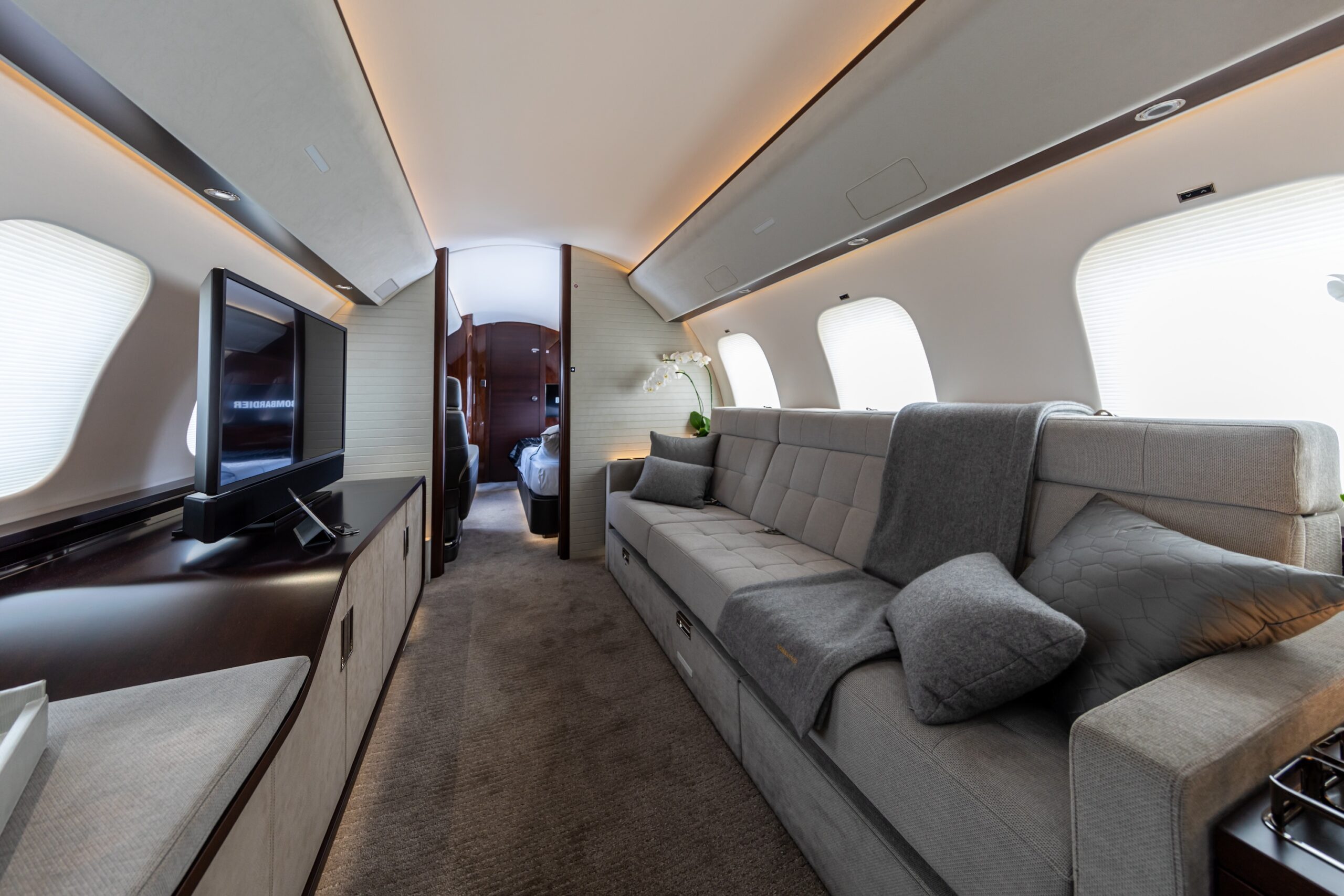 Bombardier Global 7500 Interior living area with TV and Divan