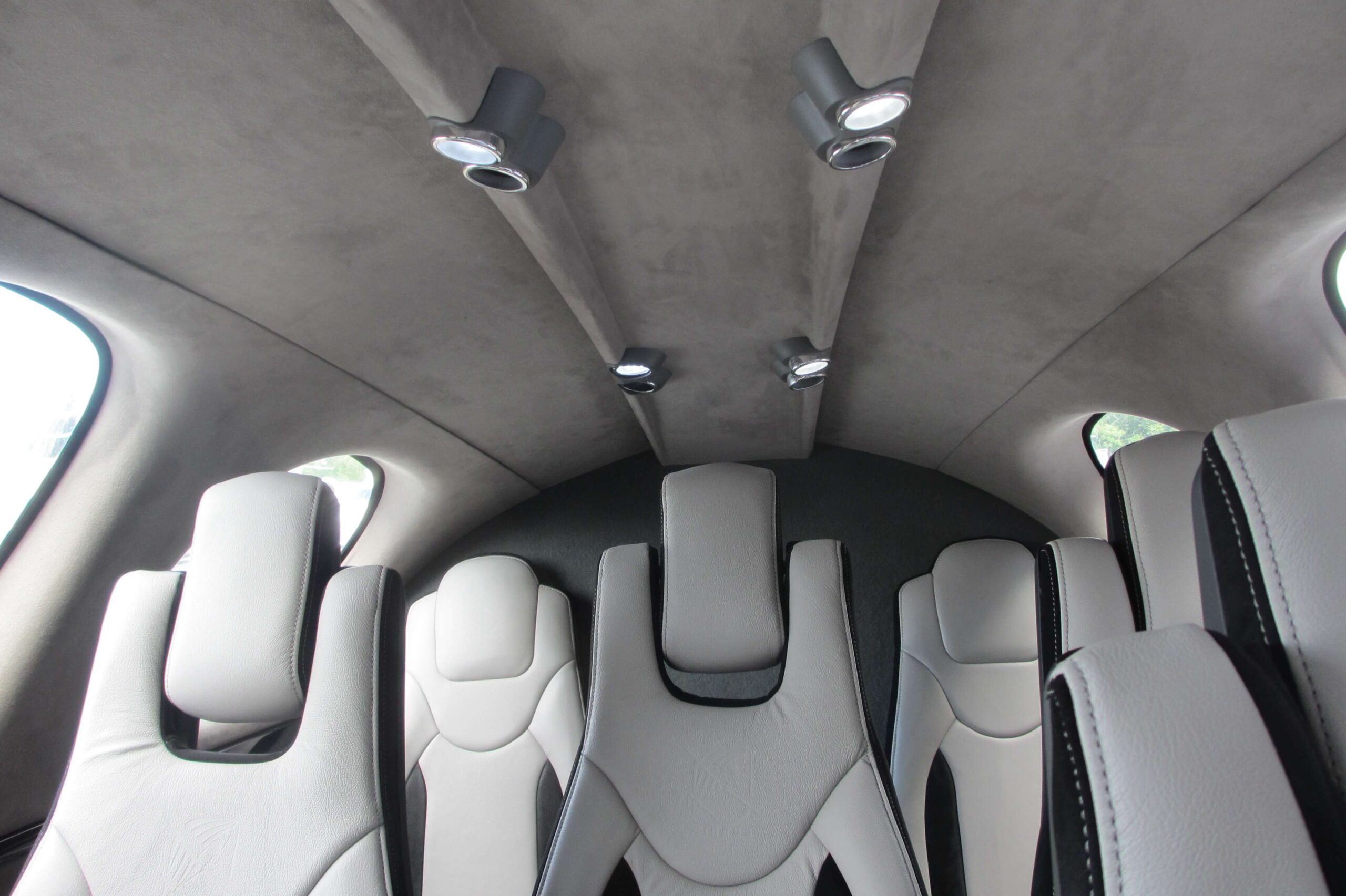Cirrus Vision Jet interior from front of cabin looking back, white seats