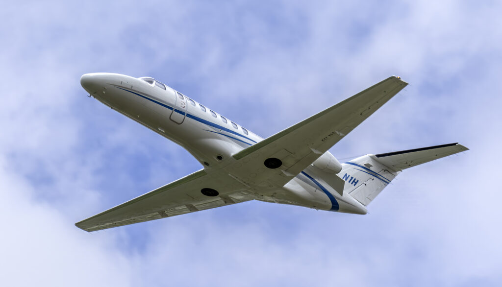 Cessna Citation CJ3 view from below flying overhead