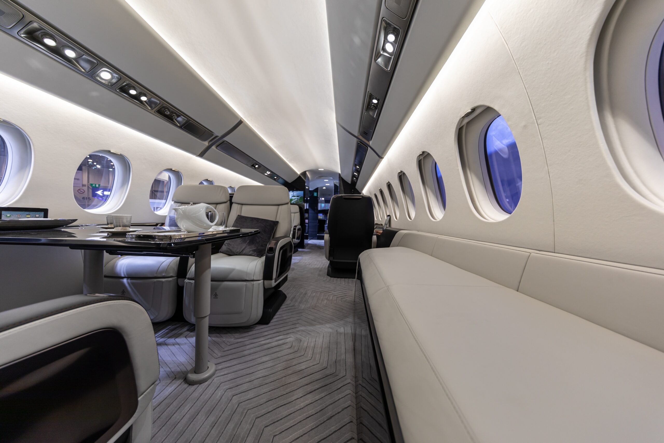Dassault Falcon 6X interior with dining area on left