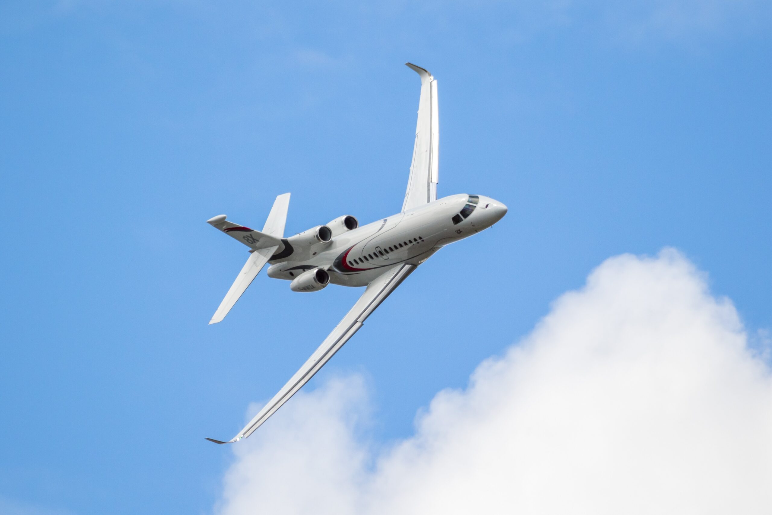 New Dassault Falcon 8X business jet performing at the Paris Air Show in steep bank