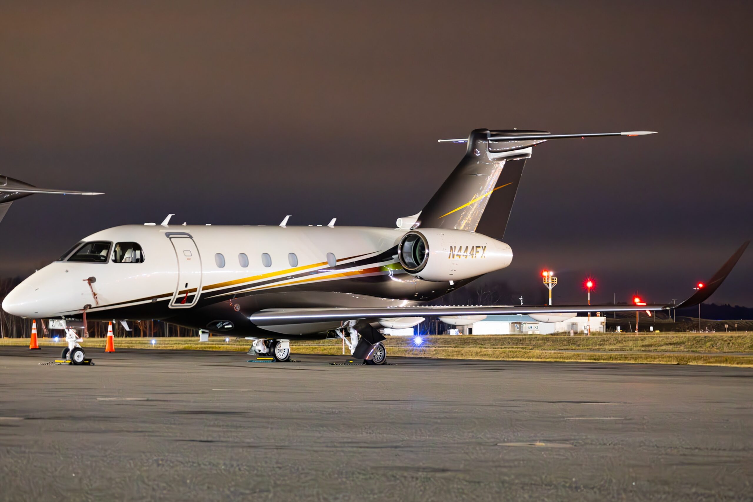 Embraer Praetor 500 exterior on ground at night reg number N44FX