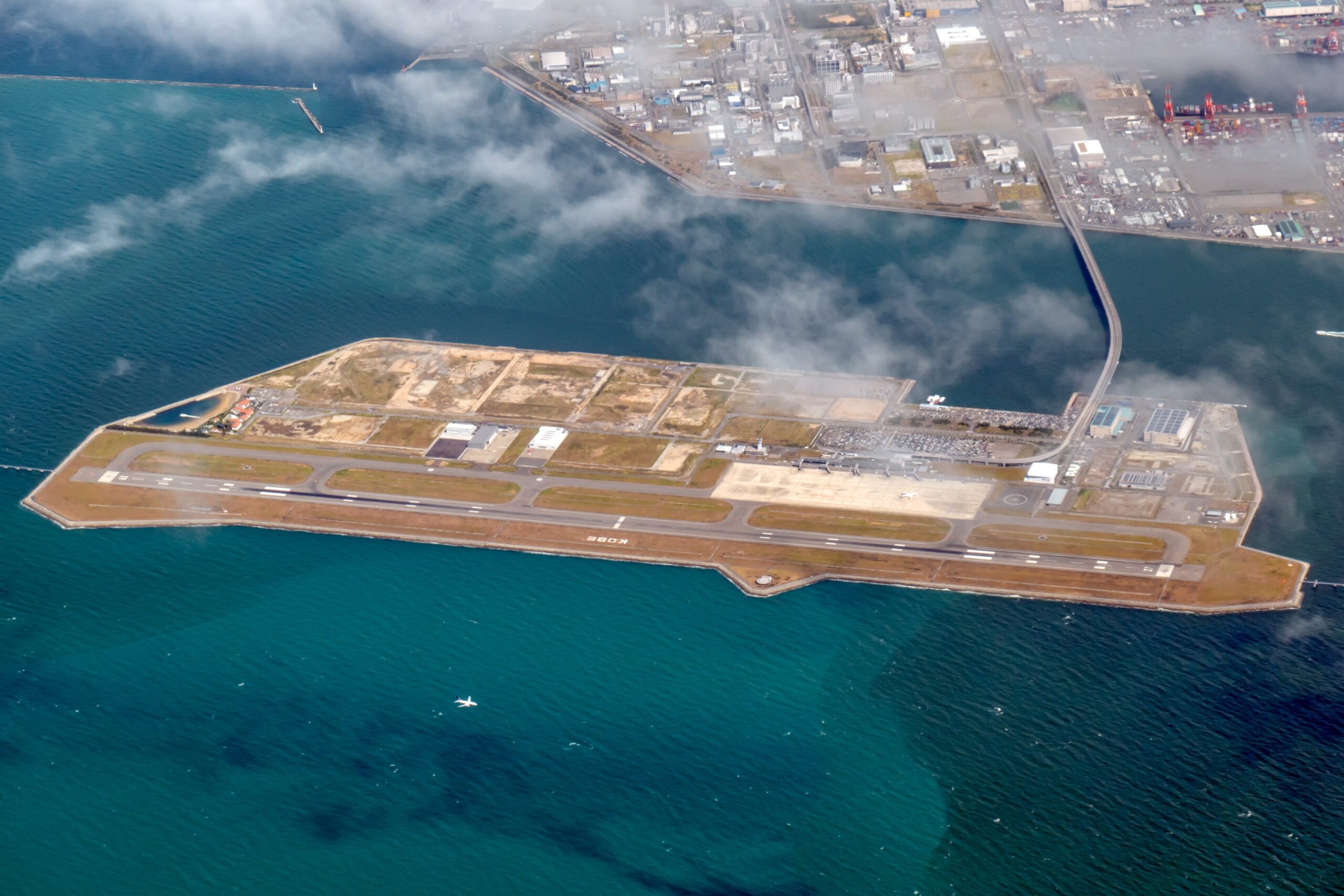 Aerial of domestic airport on the sea in Japan. Airport is on an island