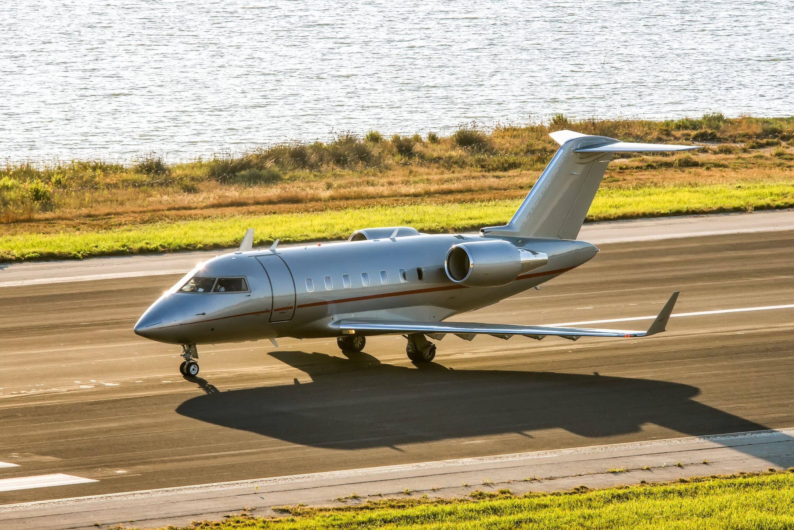 Bombardier Challenger aircraft in VistaJet livery taxiing for take off at Corfu Ioannis Kapodistrias international airport