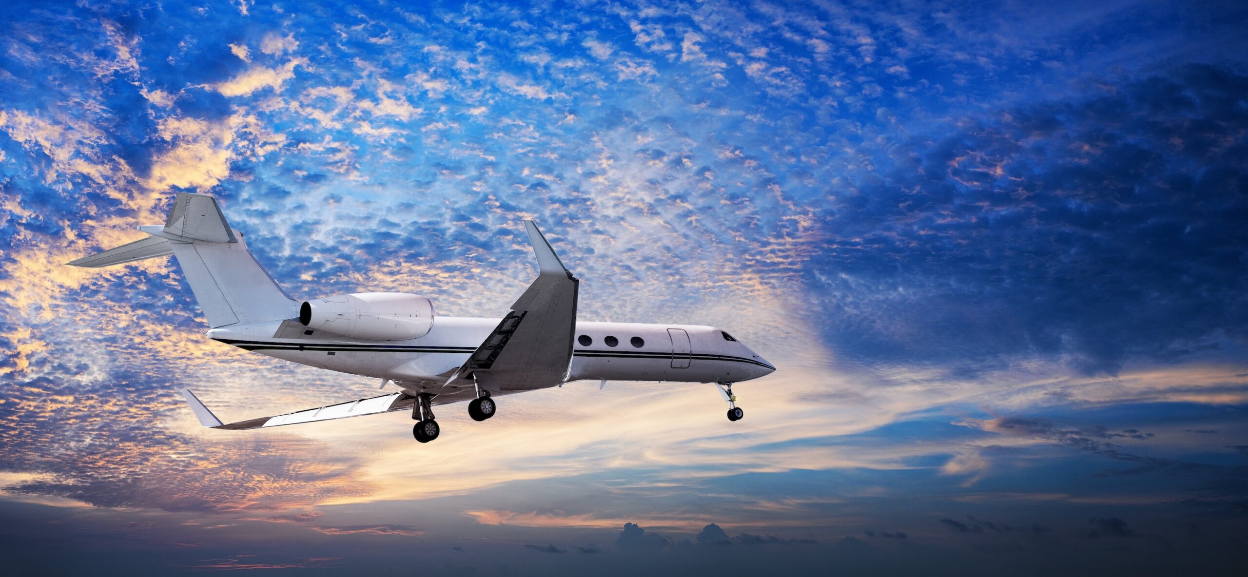 Gulfstream on approach to land with impressive sky