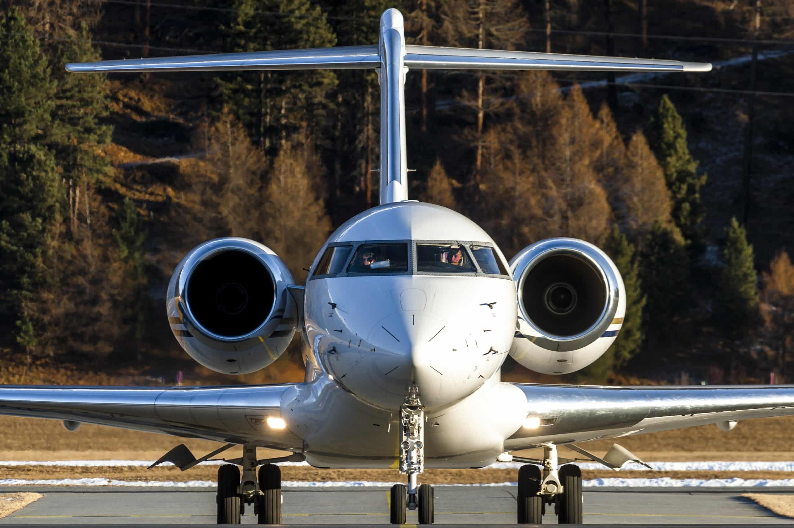 Front view of private jet just after landing with engines spinning