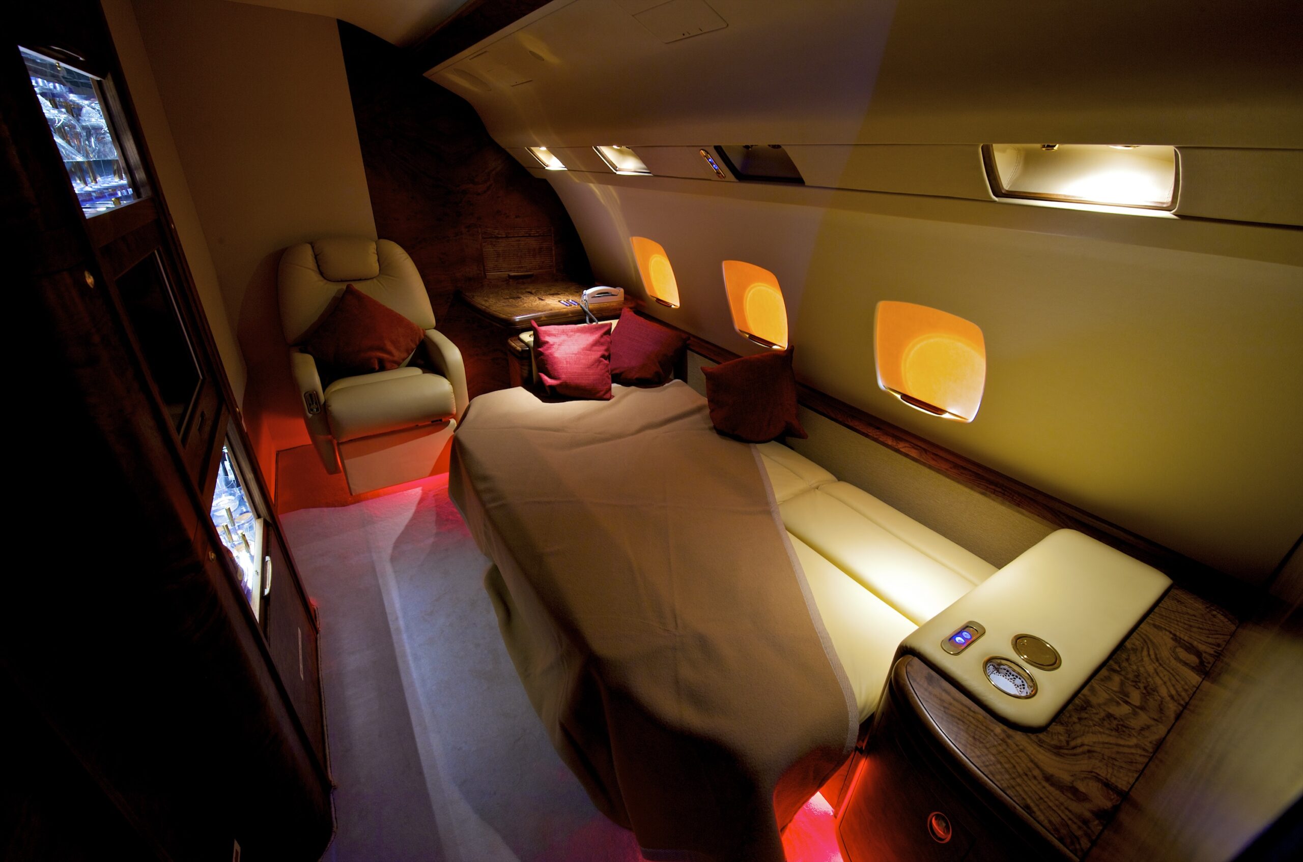 Private jet interior cabin with divan converted to bed