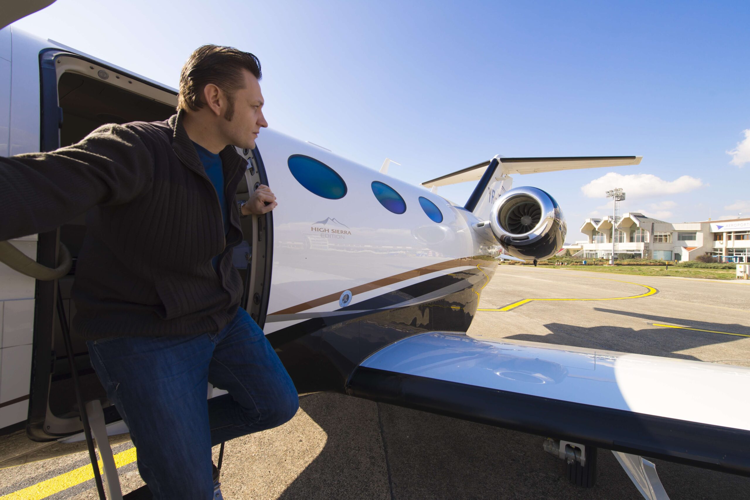 Man exiting private jet Cessna Citation Mustang