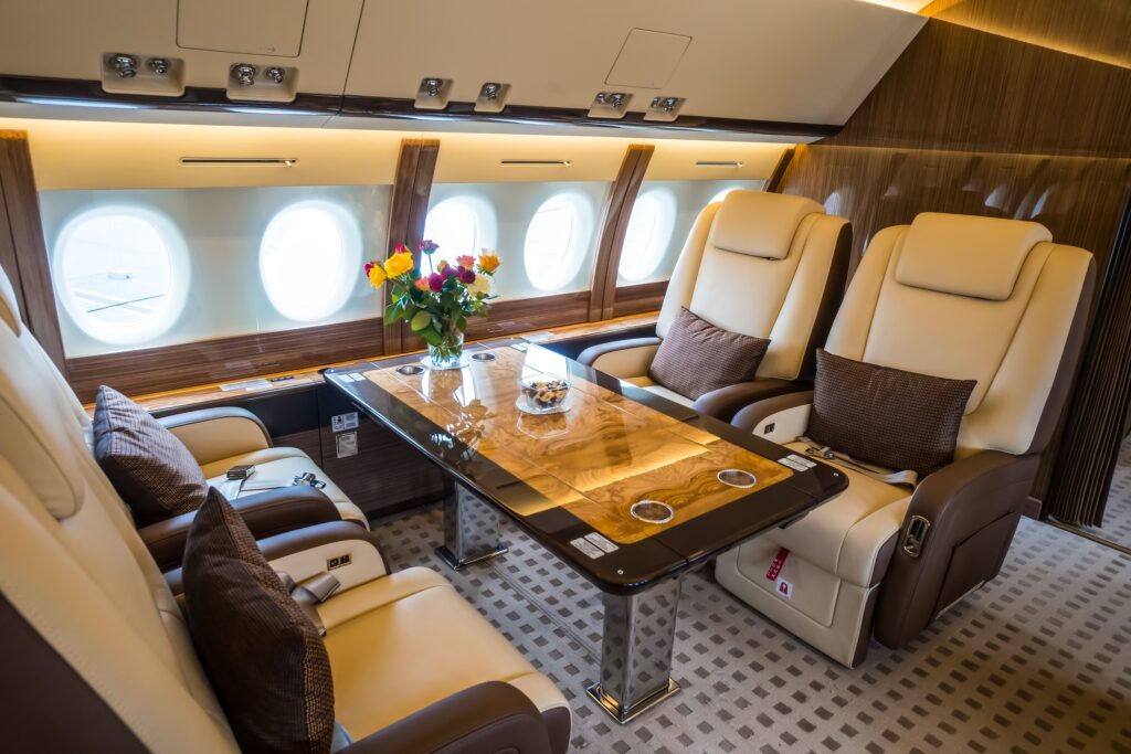 Luxury interior in the modern private business jet looking at dining table