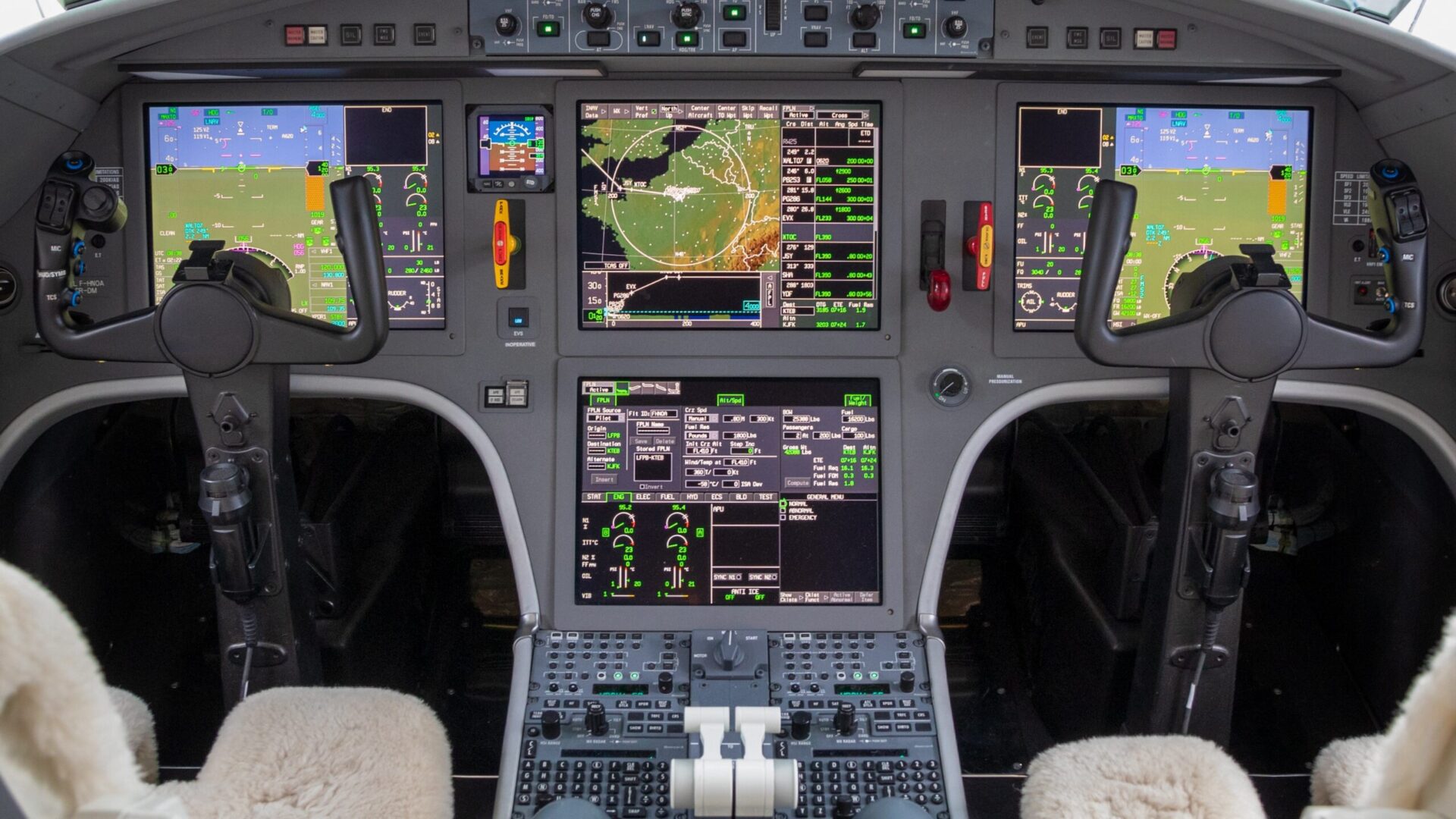 Falcon glass cockpit with avionics powered on and yokes