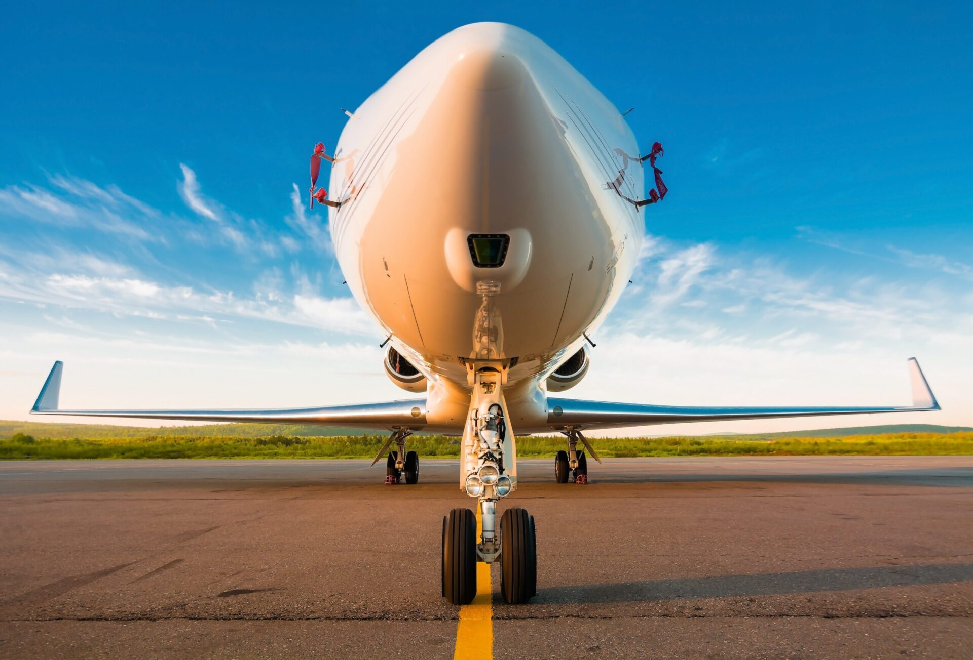 Early morning close up of nose camera on private jet parked at airport