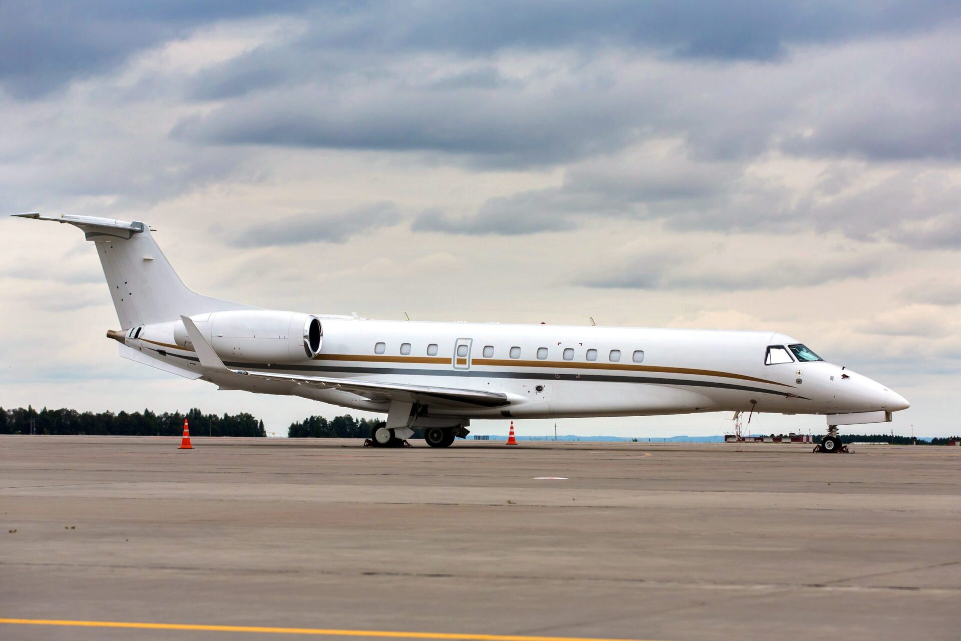 Embraer Legacy 650 exterior view side on white parked at airport