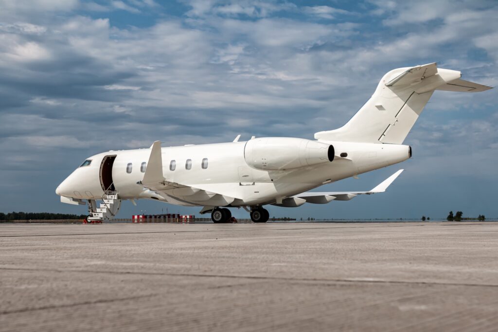 Bombardier Challenger 350 white on ground with stairs deployed