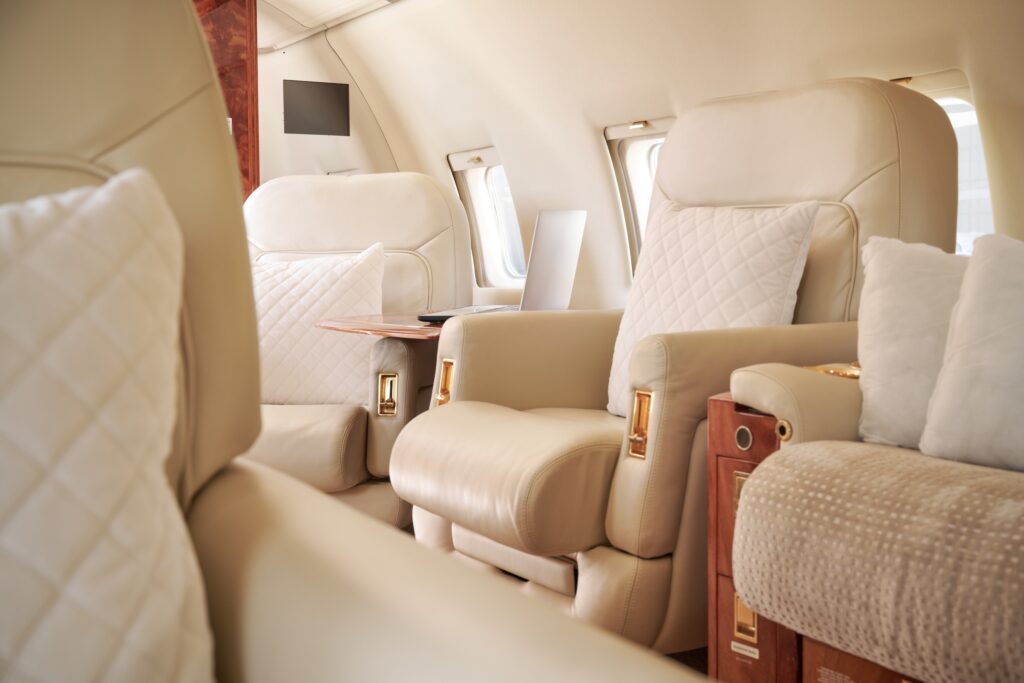 Challenger 604 beige leather interior with wood and gold accents