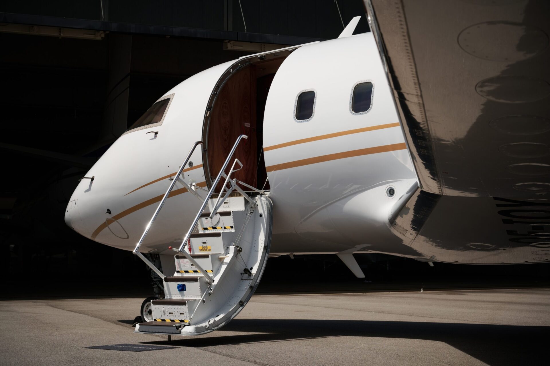 Bombardier Challenger 604 close up exterior night with stairs deployed