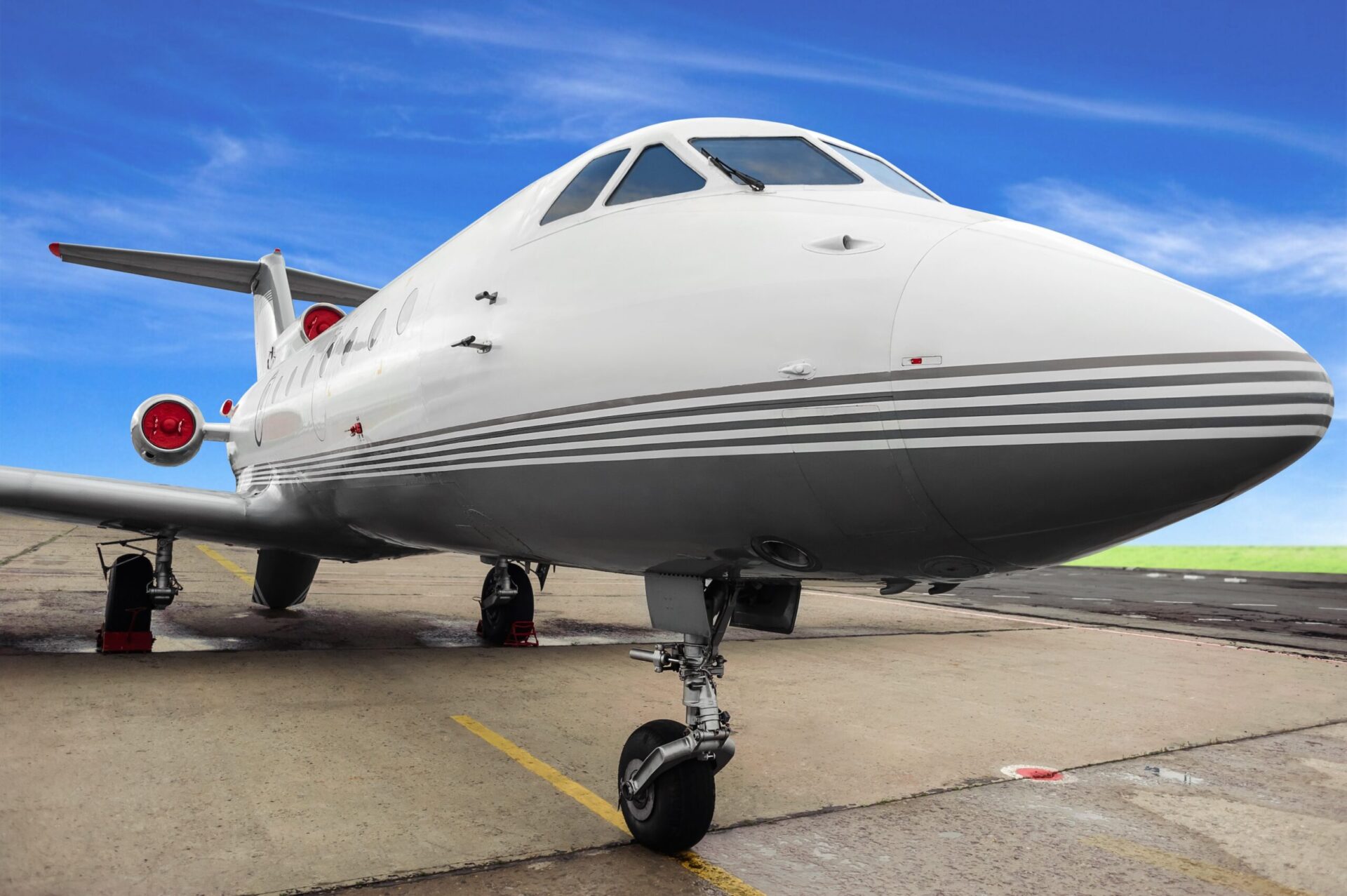 Close up nose shot of trijet aircraft parked on ramp