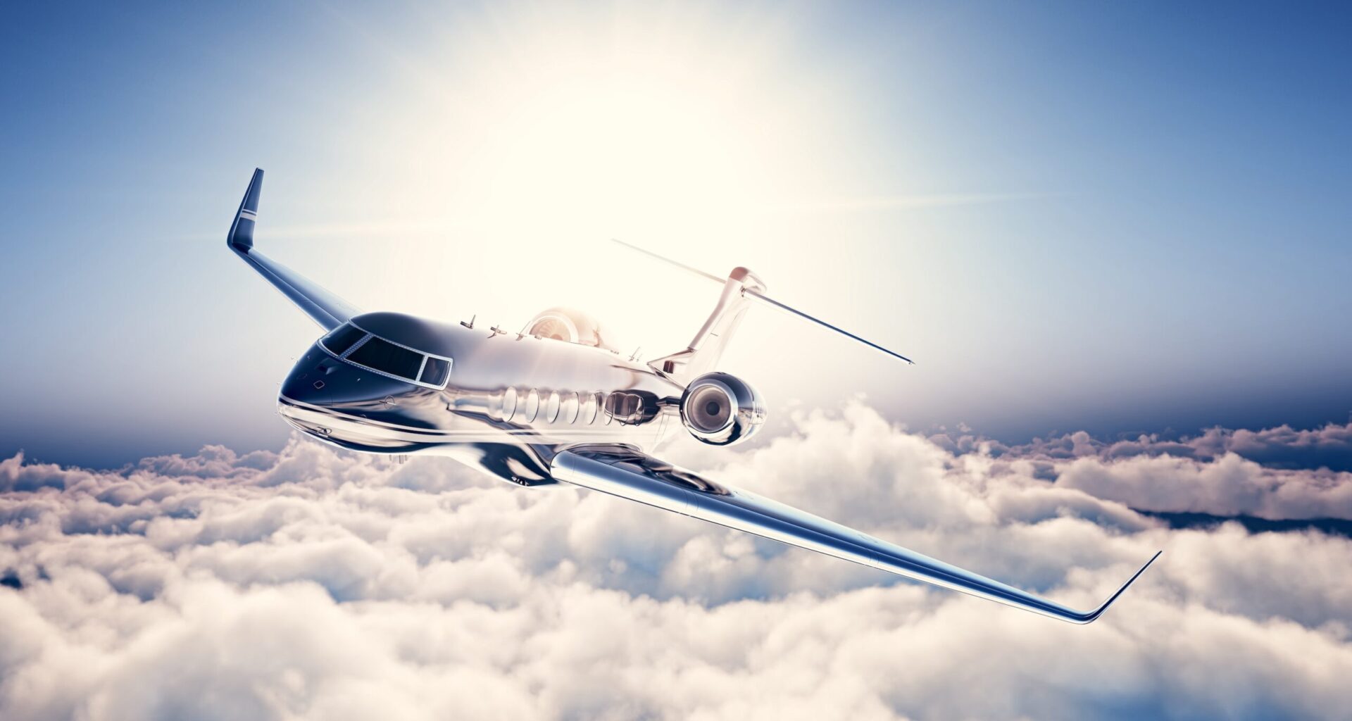 Image of black luxury generic design private jet flying in blue sky. Huge white clouds and sun at background.