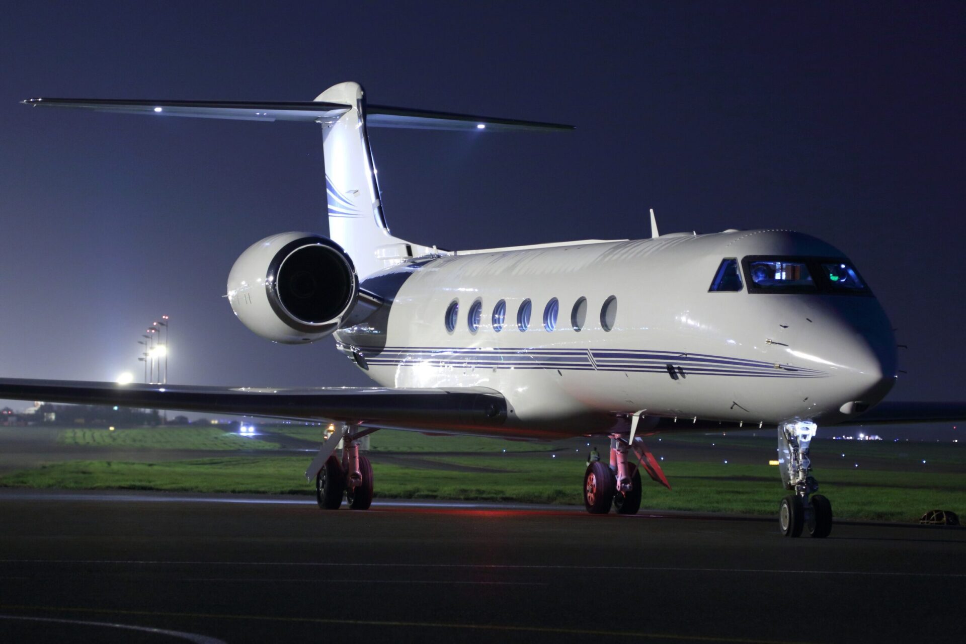 Gulfstream G450 exterior at night parked on ramp