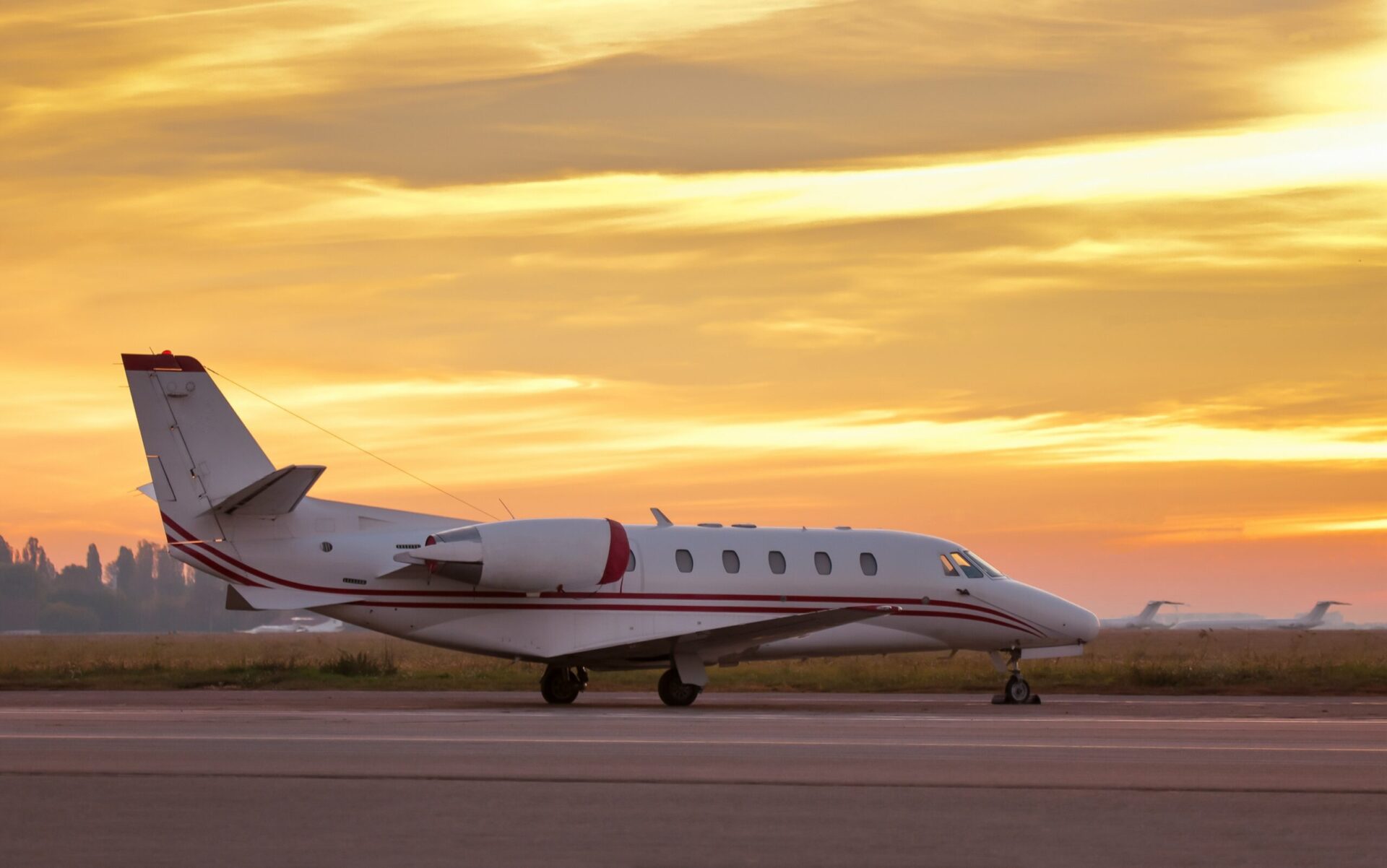 Cessna Citation XLS exterior view on ramp with golden sky behind