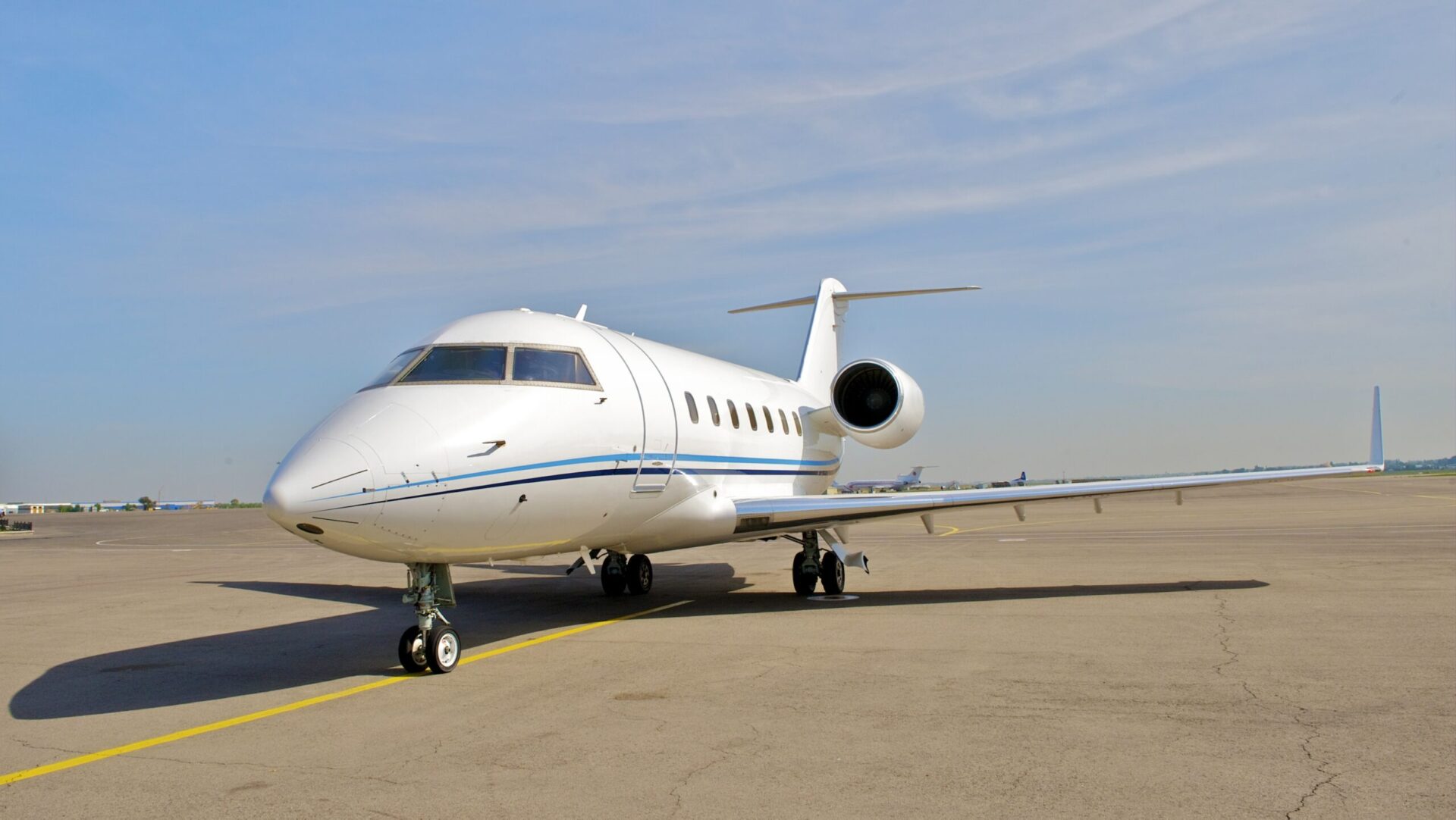 Bombardier Challenger 604 parked at airport