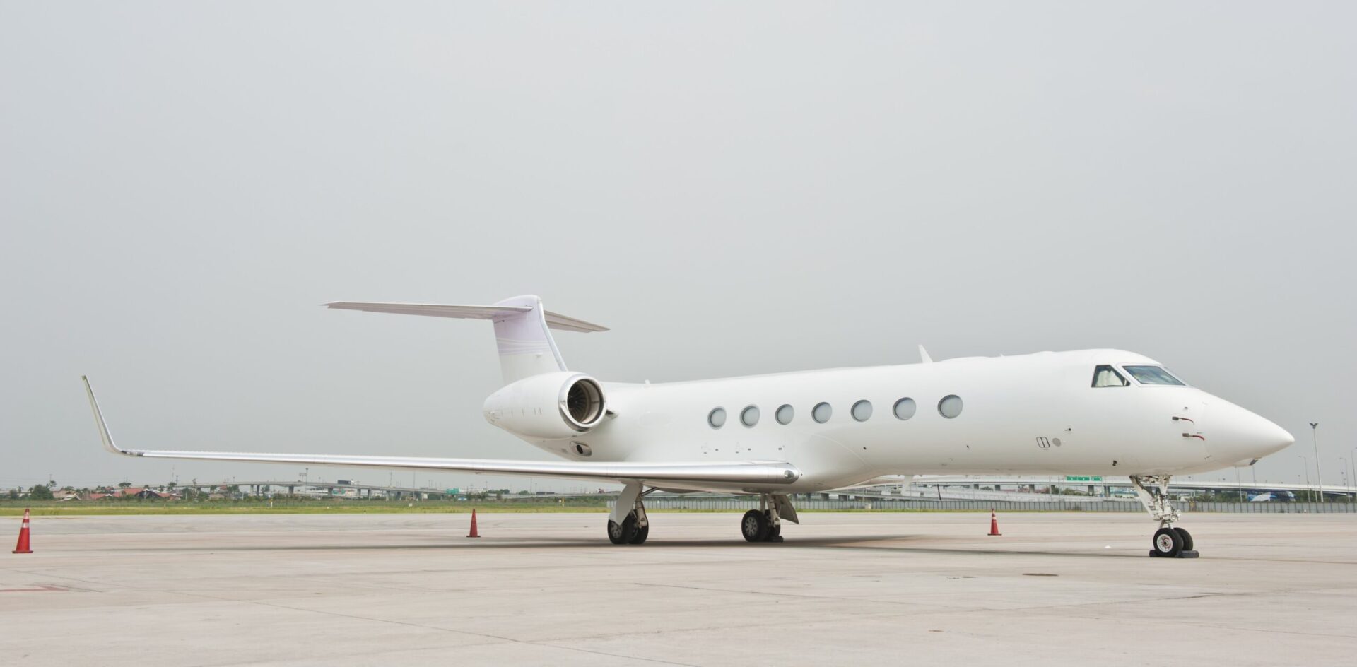 Gulfstream G550 all white parked on ramp