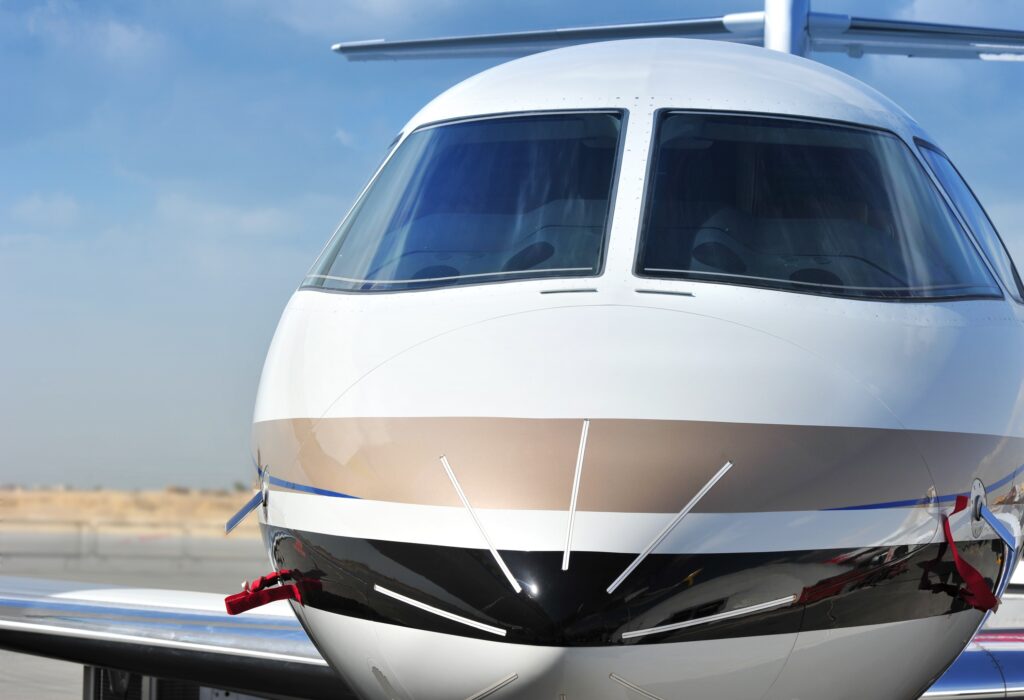Closeup of private jet cockpit windshield from the exterior