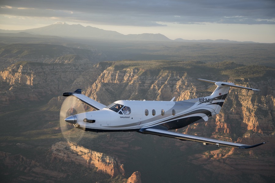 Pilatus PC-12 Exterior during cruise with mountains behind