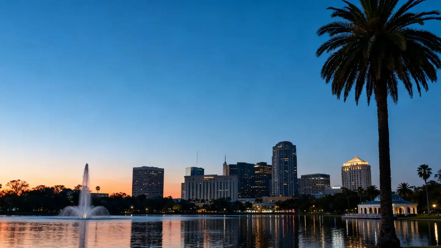 Lake Eola-style city lake in Orlando with palm trees at dusk